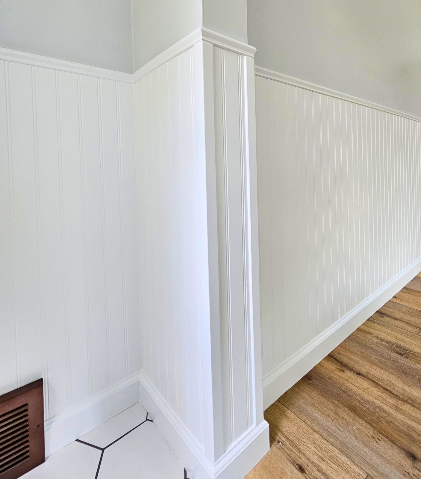 Beadboard wainscoting with chair rail in a hallway